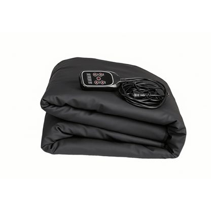 Folded SoloSauna blanket with its remote sitting on a white background. 