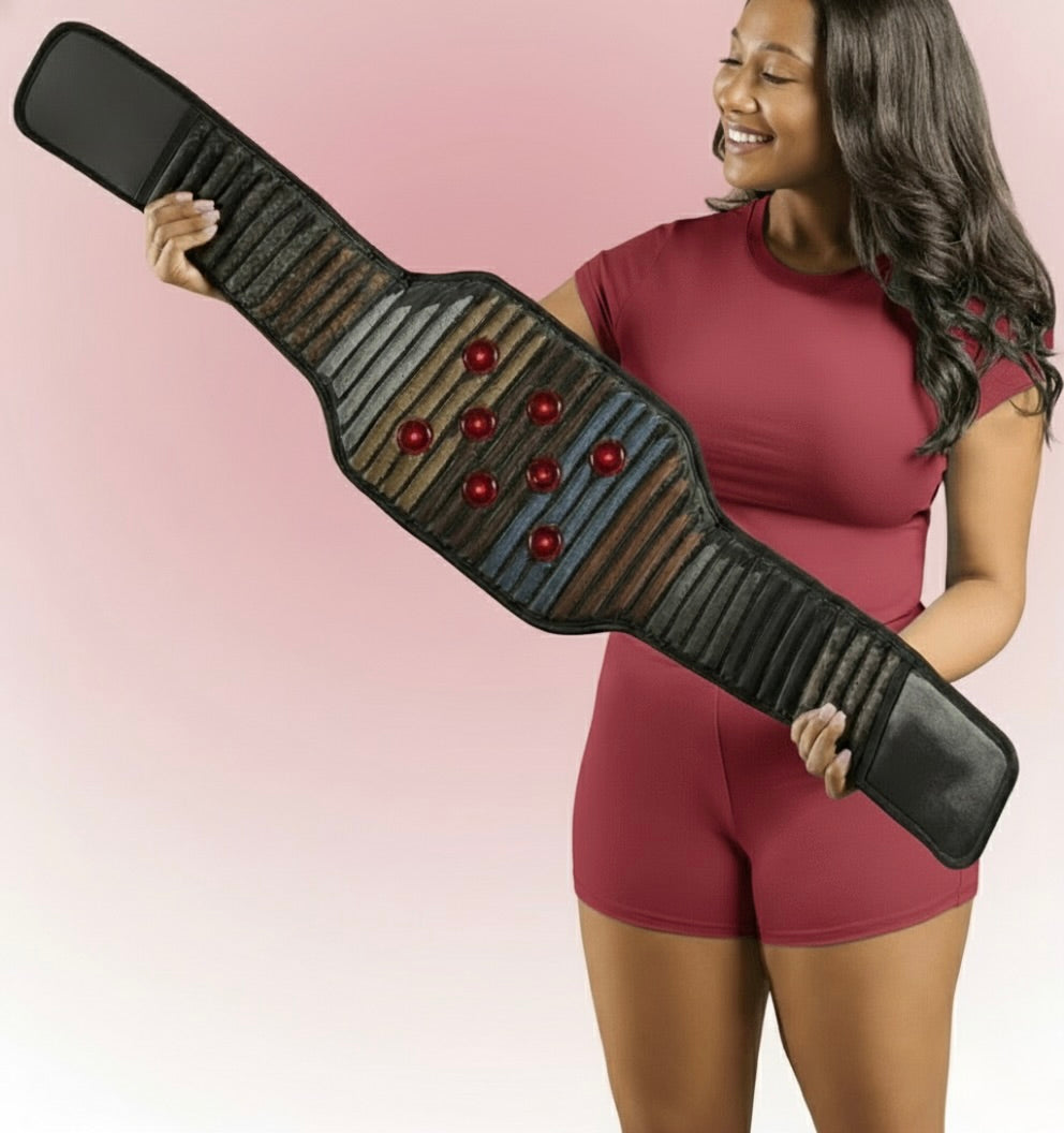 Woman holding a large belt against a pink background